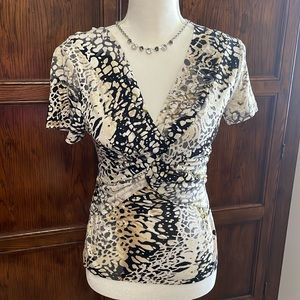 Well loved stretchy woman’s V-neck short sleeve blouse.